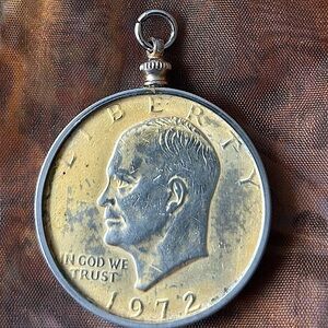 Gold-plated 1972 silver dollar pendant